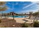 Community pool with lounge chairs and shaded seating at 5629 S Veneto --, Mesa, AZ 85212