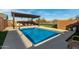 Inviting rectangular pool with pergola and lounge chairs at 5629 S Veneto --, Mesa, AZ 85212