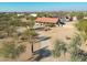 Aerial view of a desert property with a single story home and driveway at 5820 E Morning Vista Ln, Cave Creek, AZ 85331