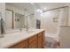 Bathroom features a bathtub, single sink vanity, and tiled walls at 5820 E Morning Vista Ln, Cave Creek, AZ 85331