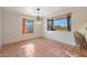 Bright dining area with large window and tiled floor at 5820 E Morning Vista Ln, Cave Creek, AZ 85331