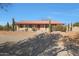 House exterior showcasing a red door and cacti at 5820 E Morning Vista Ln, Cave Creek, AZ 85331