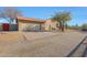 Home exterior with attached garage and desert landscaping at 5820 E Morning Vista Ln, Cave Creek, AZ 85331