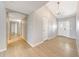 Inviting hallway with wood floors and designer lighting at 5820 E Morning Vista Ln, Cave Creek, AZ 85331