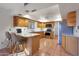 Kitchen with granite counters and light wood cabinets at 5820 E Morning Vista Ln, Cave Creek, AZ 85331