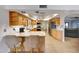 Bright kitchen with stainless steel appliances, granite counters, and a breakfast bar for dining at 5820 E Morning Vista Ln, Cave Creek, AZ 85331