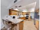 Well-lit kitchen featuring granite countertops, stainless steel appliances, and a breakfast bar at 5820 E Morning Vista Ln, Cave Creek, AZ 85331
