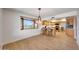 Kitchen with a breakfast bar and natural light, seamlessly connecting to the dining area at 5820 E Morning Vista Ln, Cave Creek, AZ 85331
