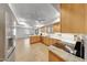 Open kitchen featuring custom cabinets, granite countertops, and stainless steel appliances at 5820 E Morning Vista Ln, Cave Creek, AZ 85331