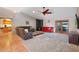 Spacious living room with red couch and fireplace at 5820 E Morning Vista Ln, Cave Creek, AZ 85331