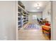 Home office featuring built-in shelving, a desk, and a large window at 5820 E Morning Vista Ln, Cave Creek, AZ 85331