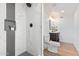 Modern bathroom with white marble shower, vanity, and toilet at 6409 W Orange Dr, Glendale, AZ 85301