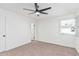 Bright bedroom with neutral carpeting and ceiling fan at 6409 W Orange Dr, Glendale, AZ 85301