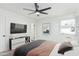 Contemporary bedroom featuring a plush bed, modern furniture, and a bright atmosphere with natural light at 6409 W Orange Dr, Glendale, AZ 85301