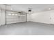 Garage with automatic door and painted concrete floor at 6409 W Orange Dr, Glendale, AZ 85301