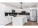 Modern kitchen with white cabinets and a large island at 6409 W Orange Dr, Glendale, AZ 85301