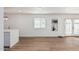 Bright living room featuring hardwood floors and French doors leading to the backyard at 6409 W Orange Dr, Glendale, AZ 85301