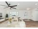 Bright and airy living room with a cozy sectional sofa, modern decor, and plenty of natural light at 6409 W Orange Dr, Glendale, AZ 85301