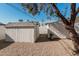 Two white storage sheds in the backyard, one is a barn style at 6409 W Orange Dr, Glendale, AZ 85301