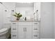 Modern bathroom with white cabinets and a quartz countertop at 725 E Vaughn Dr, Tempe, AZ 85283