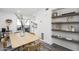 Light and bright dining area with a wood table and built-in shelving at 725 E Vaughn Dr, Tempe, AZ 85283