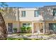 Updated exterior of charming townhome, featuring a welcoming front entrance and landscaping at 725 E Vaughn Dr, Tempe, AZ 85283