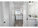 Clean hallway with a view into the kitchen and bathroom at 725 E Vaughn Dr, Tempe, AZ 85283