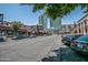 Street view showing urban setting with shops and high-rise buildings at 725 E Vaughn Dr, Tempe, AZ 85283