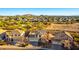 Aerial view of a house and surrounding neighborhood at 7409 W Briles Rd, Peoria, AZ 85383