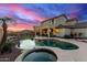 Stunning backyard with pool, spa, waterfall, and built-in BBQ at 7409 W Briles Rd, Peoria, AZ 85383