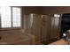 Spa-like bathroom with soaking tub, shower, and walk-in closet at 7409 W Briles Rd, Peoria, AZ 85383