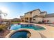 Two-story house featuring a sparkling pool and relaxing spa at 7409 W Briles Rd, Peoria, AZ 85383