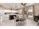 Kitchen with island, white cabinets, and breakfast nook at 7409 W Briles Rd, Peoria, AZ 85383