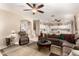 Living room with comfortable seating and views into the kitchen at 7409 W Briles Rd, Peoria, AZ 85383