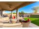 Relaxing covered patio with wicker furniture at 7409 W Briles Rd, Peoria, AZ 85383