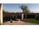 Relaxing pool area with artificial turf, a waterfall, and potted plants at 7409 W Briles Rd, Peoria, AZ 85383