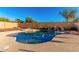 Large kidney shaped pool with a waterfall at 7409 W Briles Rd, Peoria, AZ 85383