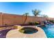 Inviting pool with spa and waterfall feature at 7409 W Briles Rd, Peoria, AZ 85383