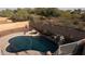 Private backyard pool with spa and rock waterfall feature at 7409 W Briles Rd, Peoria, AZ 85383