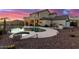 Stunning kidney-shaped pool with a spa and waterfall feature at 7409 W Briles Rd, Peoria, AZ 85383