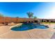 Relaxing kidney-shaped pool with waterfall feature at 7409 W Briles Rd, Peoria, AZ 85383