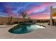 Relaxing kidney-shaped pool with a waterfall feature at 7409 W Briles Rd, Peoria, AZ 85383