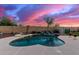 Relaxing kidney-shaped pool and spa with waterfall feature at 7409 W Briles Rd, Peoria, AZ 85383