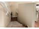 Elegant staircase with hardwood flooring and neutral-colored carpeting at 7409 W Briles Rd, Peoria, AZ 85383