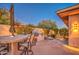 Outdoor kitchen, seating area, and flagstone patio with desert landscaping at 7462 E Visao Dr, Scottsdale, AZ 85266