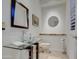 Modern bathroom with a glass sink and a frameless mirror at 7462 E Visao Dr, Scottsdale, AZ 85266