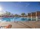 Large community pool with stone accents and lounge chairs at 7462 E Visao Dr, Scottsdale, AZ 85266