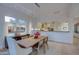 Elegant dining room with a view into the kitchen and living areas at 7462 E Visao Dr, Scottsdale, AZ 85266