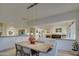 Open concept dining room adjacent to the living room and kitchen at 7462 E Visao Dr, Scottsdale, AZ 85266