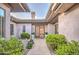 Inviting entryway with a courtyard and lush landscaping at 7462 E Visao Dr, Scottsdale, AZ 85266